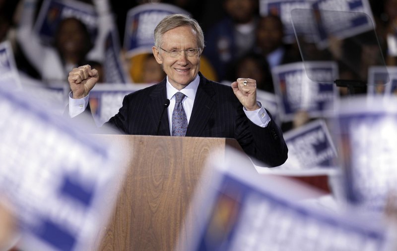 Harry Reid, the Senate majority leader, acknowledges supporters at a rally Monday in Las Vegas. Like many other Democrats, he is locked in a tight race for re-election, facing a tough challenge in Nevada from tea party Republican Sharron Angle.