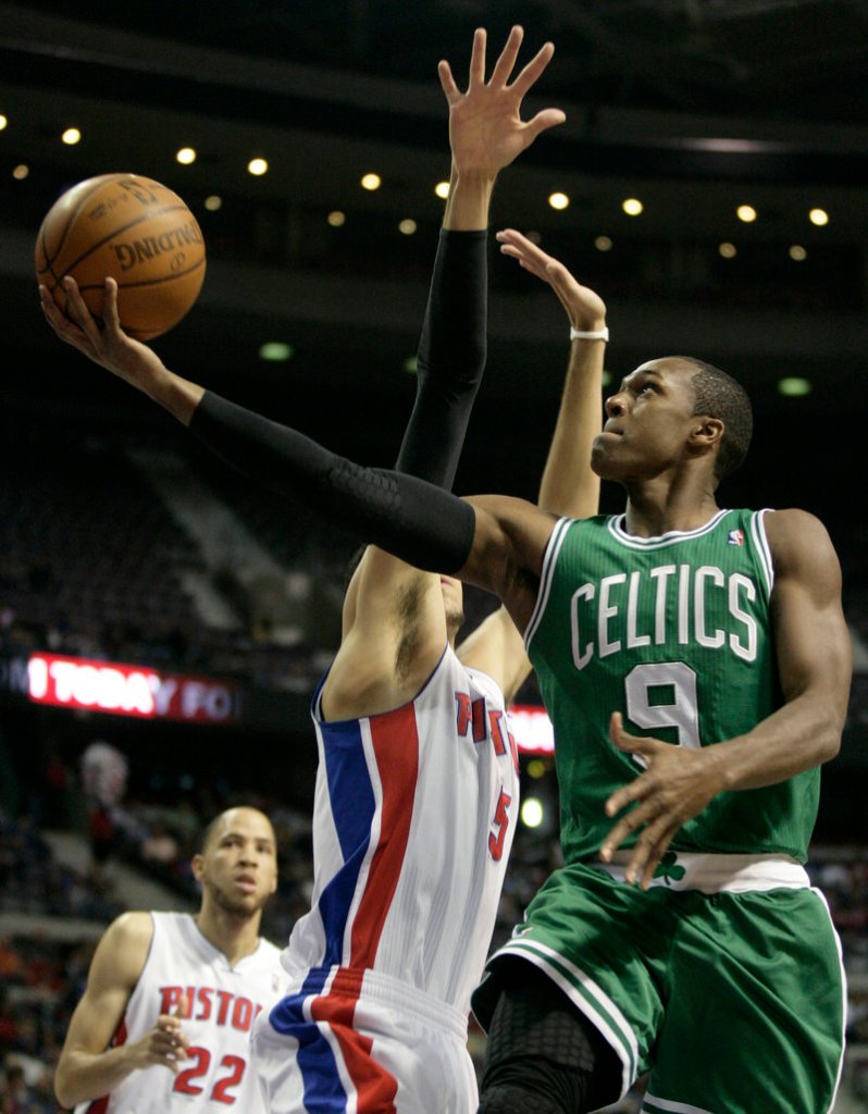 Rajon Rondo of the Celtics gets inside for a layup against Detroit’s Austin Daye. Rondo had nine points and 17 assists to lead Boston to an easy 109-86 victory, dropping the Pistons to 0-4 on the season.