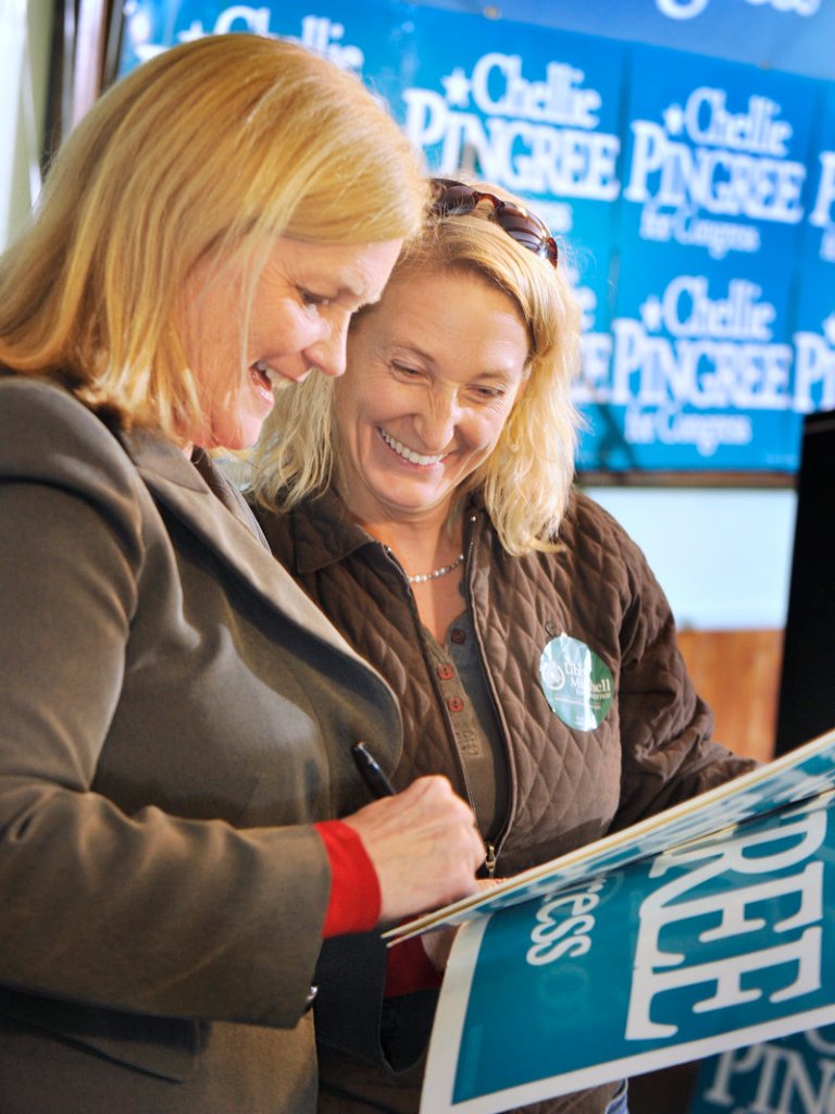 Newly re-elected U.S. Rep. Chellie Pingree of Maine’s 1st District autographs a campaign poster for Melanie Collins of Falmouth following her win.