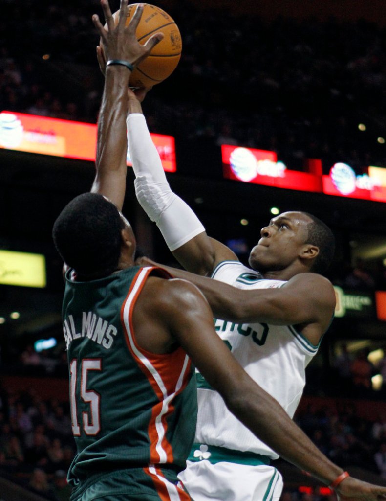 Rajon Rondo of the Boston Celtics drives against John Salmons of the Milwaukee Bucks in the first quarter Wednesday night.