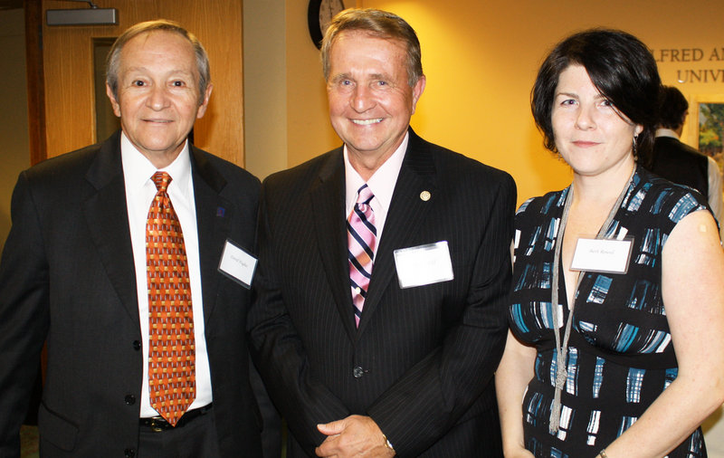 Charles Hoff, David Hughes and Beth Round, who heads USM's Honors Program.
