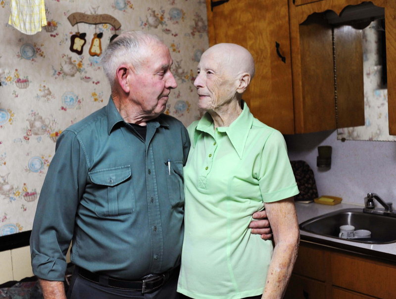 Allen and Violet Large stand arm-in-arm in the kitchen of their Lower Truro, Nova Scotia, home. The couple gave away about $10.6 million in lottery winnings.
