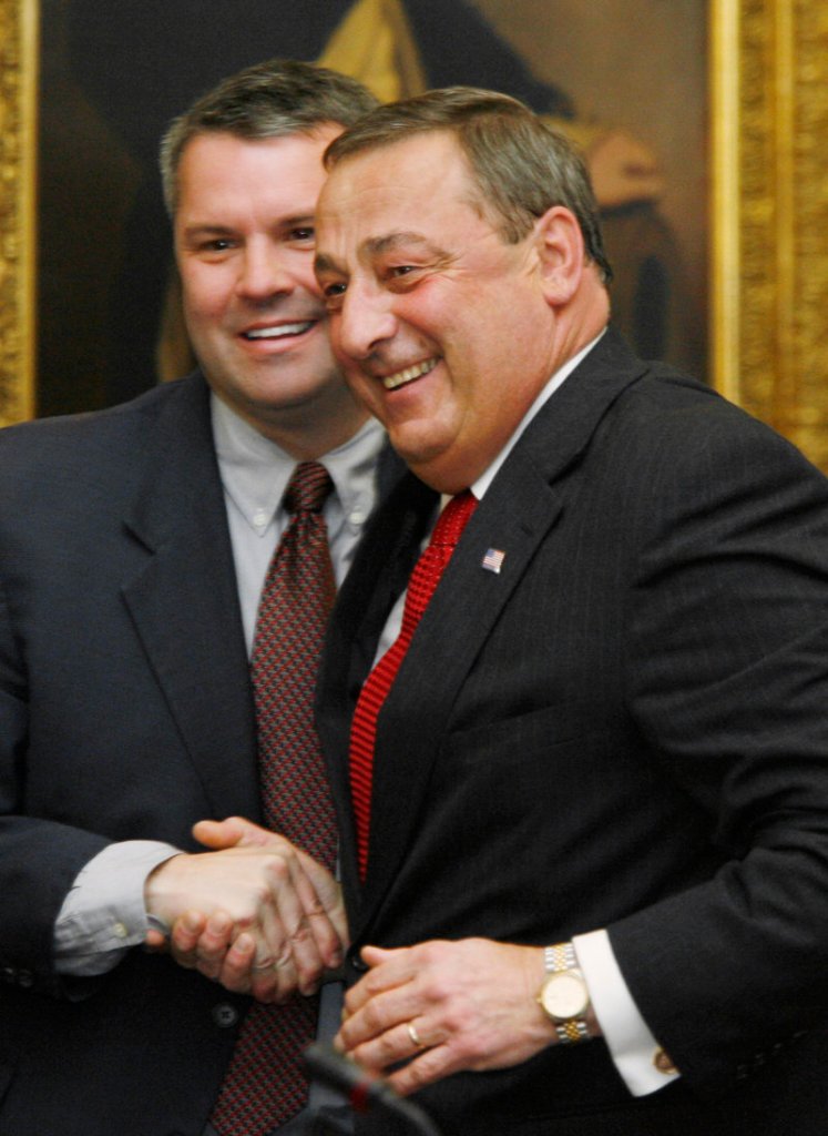 Maine Gov.-elect Paul LePage, right, greets newly elected Senate Majority Leader Jonathan Courtney of Springvale at the Senate Republican caucus Friday in Augusta.