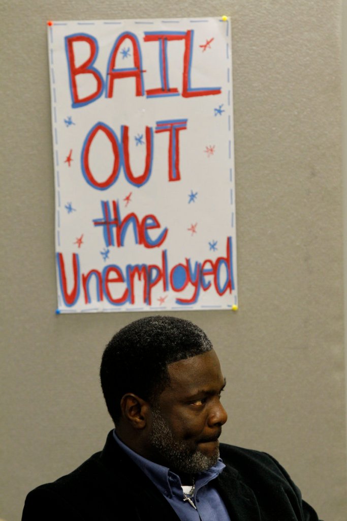 Dennis Spain, who has been unemployed for two months, listens to others relate their experiences with joblessness at a Philadelphia Unemployment Project meeting Thursday. Up to 2 million people could lose unemployment benefits if Congress doesn t act.