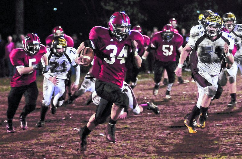 Louis DiTomasso of Wells breaks into the open on his way to a 68-yard touchdown run in the second quarter of a 47-7 victory over Cape Elizabeth in a Western Class B football semifinal Friday night at Wells.