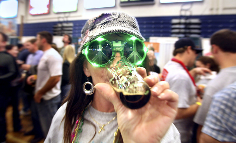 Rosie Stadig of Lebanon samples one of the 14 beers offered Saturday at the Maine Brewers Festival at the Portland Expo.