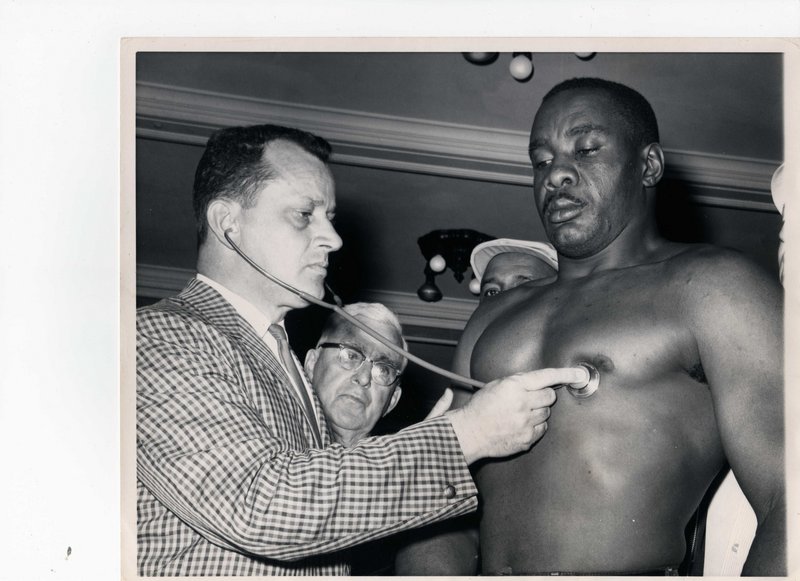 Dr. Raphael Turgeon examines Sonny Liston prior to the infamous 1965 fight with Cassius Clay in Lewiston.
