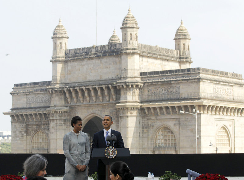 President Obama and first lady Michelle Obama visit the memorial for victims of the 2008 terror attack at the Taj Mahal Palace and Tower hotel in Mumbai, India, on Saturday.
