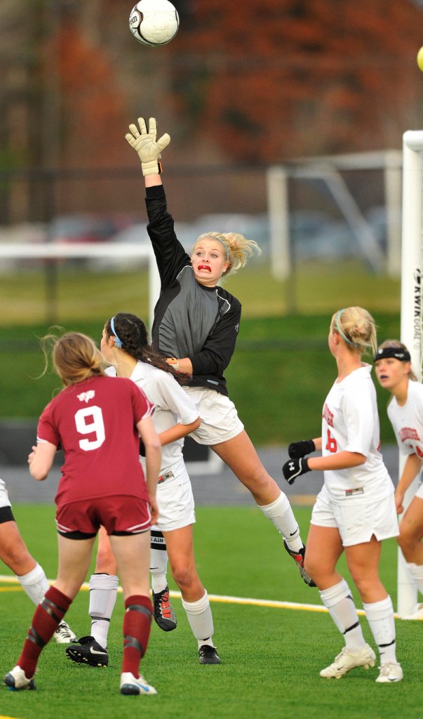 Scarborough goalie Jill Deering leaps to bat away a corner kick Saturday during the 3-0 victory against Bangor. The Red Storm finished 18-0 and allowed one goal all season.