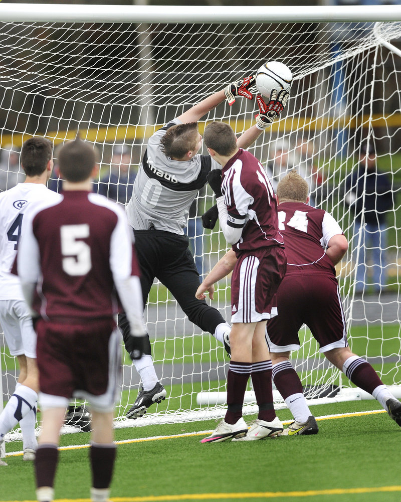 Yarmouth keeper Chris Knaub makes an off-balance save on an Ellsworth shot Saturday to preserve the Clippers shutout of the Eagles. Yarmouth finished the season at 17-0-1.