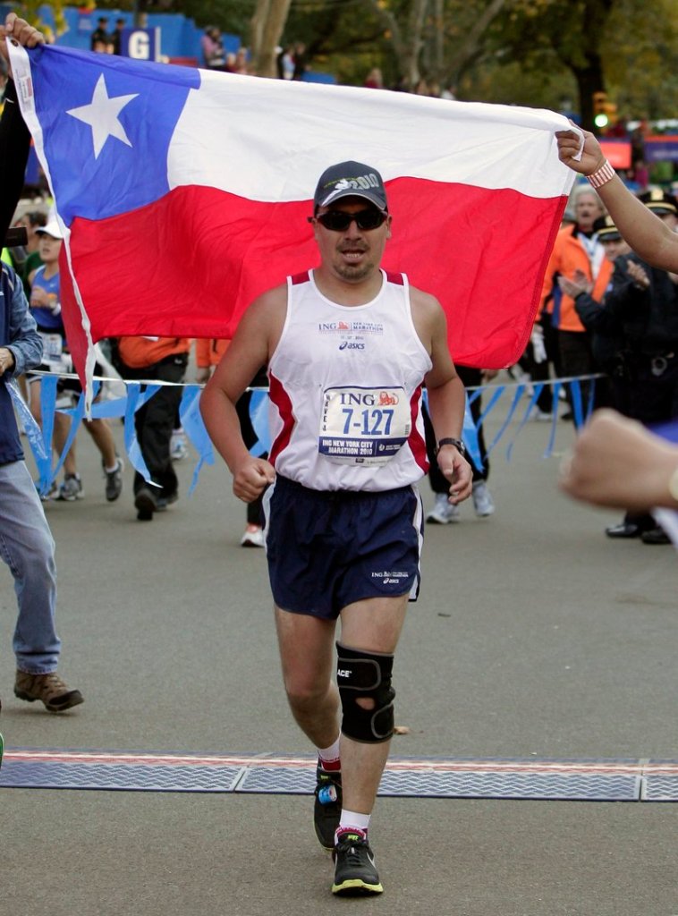 Chilean miner Edison Pena approaches the finish line after running in the New York City marathon on Sunday.