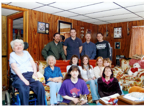 Family members join Susan M. Buccina, sitting at left, for a celebration of her 57th birthday in May 2009.