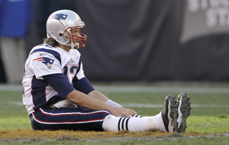 Tom Brady appears to consider what to do next after being knocked to the ground on Sunday in Cleveland. He completed 19 of 36 passes for 224 yards and two touchdowns.