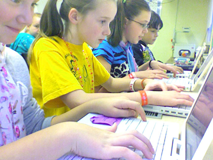 Bonny Eagle Middle School students, from left, Samantha Morash, Calleigh McCullough, Megan Roy and Zach Steinwachs, participate in an online session to solve a math problem during a recent American Math Challenge event.