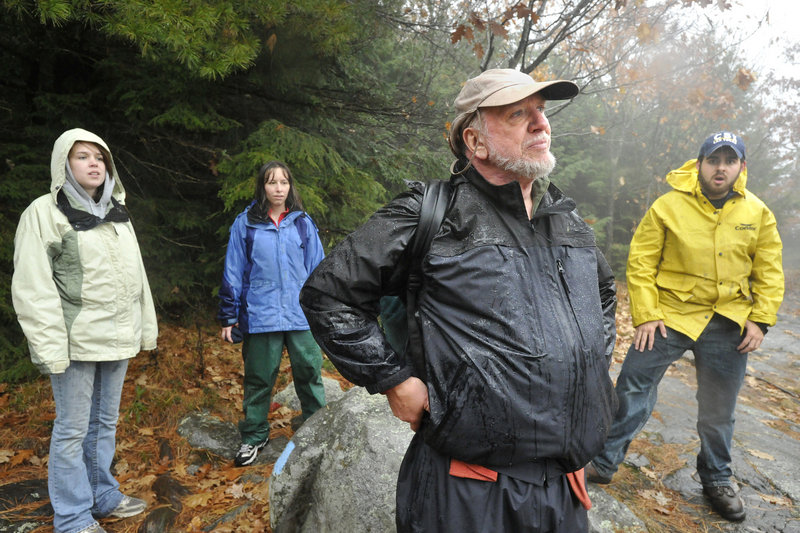 University of New England Professor Owen Grumbling and some of his students in a nature writing class stop at an overlook on Burnt Meadow Mountain in Brownfield.
