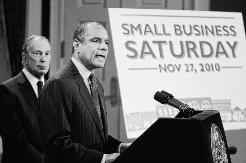 Kenneth Chenault, CEO of American Express, right, speaks while New York City Mayor Michael Bloomberg listens during a news conference in New York to announce a program aimed at benefiting small businesses.