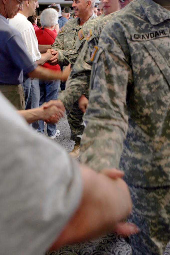 Maine residents greet returning service members in this 2007 file photo taken at Bangor Airport.