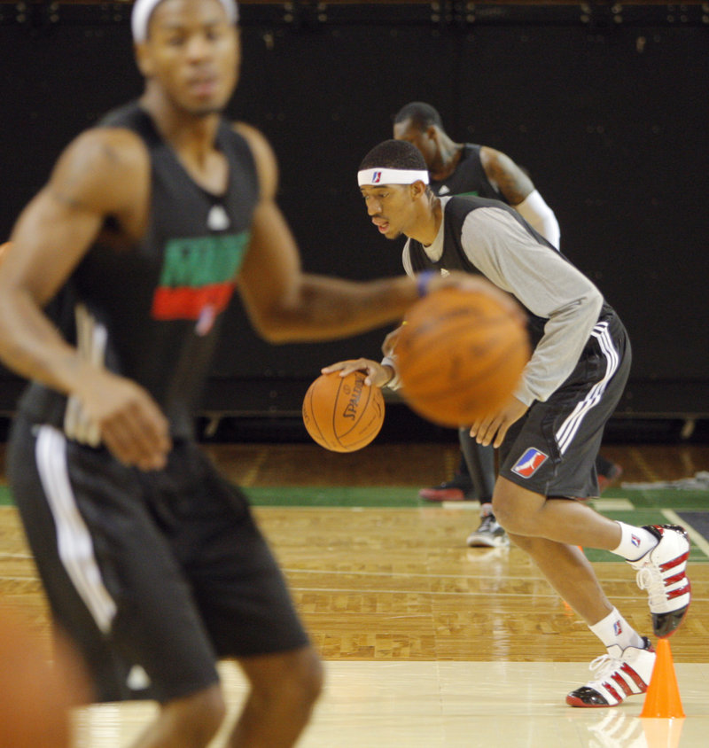 Magnum Rolle dribbles his way down the court during practice for the Red Claws, who will open their second D-League season Nov. 19 at the Portland Expo.