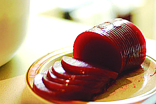 Sound effects – schlurp – accompany the escape of cranberry sauce from the can.