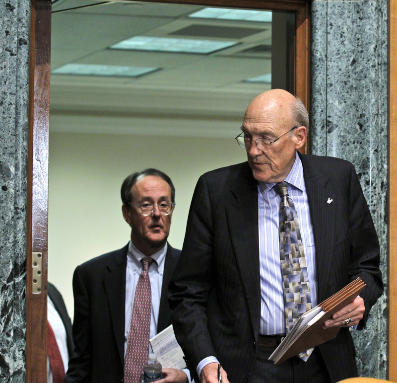 Erskine Bowles, left, follows former Wyoming Sen. Alan Simpson before a news conference Wednesday on Capitol Hill. The co-chairmen of President Obama’s bipartisan deficit commission outlined the panel’s preliminary proposals, including eliminating some income-tax deductions and raising the federal gas tax by 15 cents in 2013.