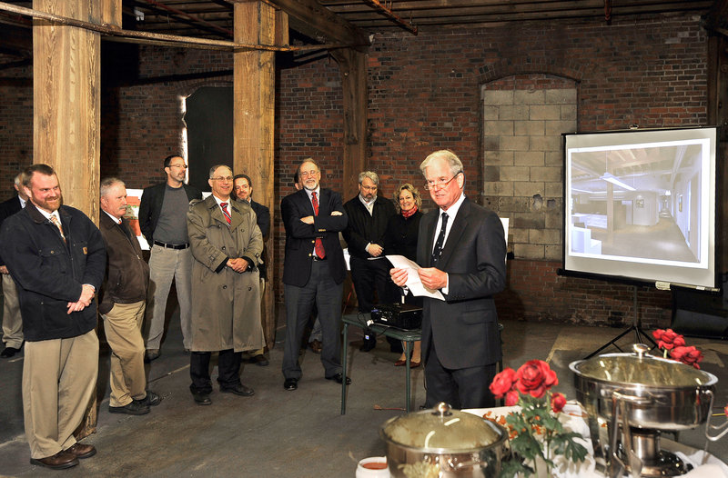 Coleman Burke of Waterfront Maine, owner of the Cumberland Cold Storage Building and developer of the Pierce Atwood project, speaks at a reception Wednesday.