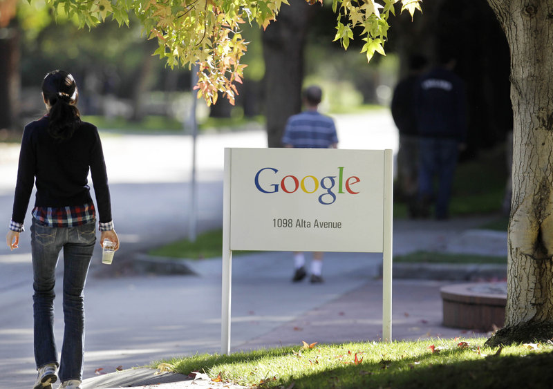 Employees walk around Google’s campus in Mountain View, Calif., on Wednesday. The company is renowned for pampering its workers with free food and other perks.