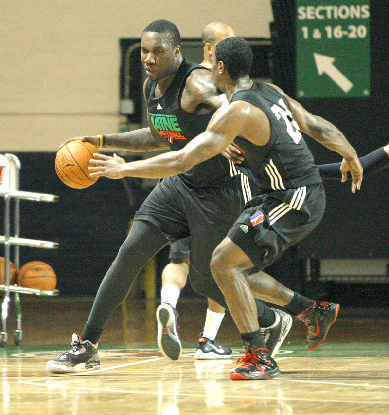 Keith 'Tiny' Gallon drives around a defender at Maine Red Claws practice Tuesday at the Portland Expo. The 19-year-old's guard-like athleticism could make him a versatile post player once he improves his inside game.