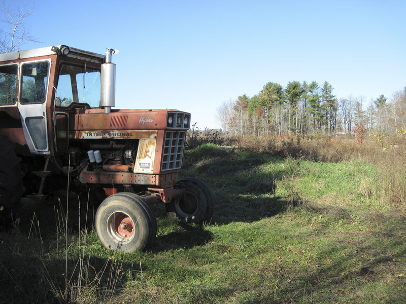 A derelict tractor stands idle on the southwest corner of a 100-acre plot of former farmland off Route 26, Friday. Construction of a 65,000-square-foot casino and resort may begin as early as next spring. Black Bear Entertainment, the developer, expects the first phase of the project to be completed by next year, with a grand opening planned for December 2011.