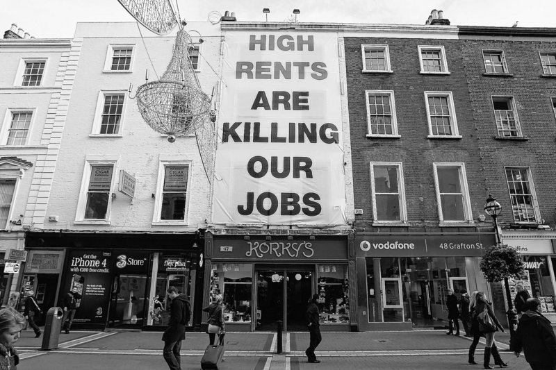 Irish troubles: A banner complaining about high shop rents is hung on a storefront Friday in central Dublin.