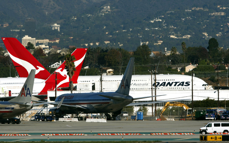 Two Qantas A380 superjumbo jets await inspection at Los Angeles International Airport on Friday. Last week leaking oil caused an engine to blow up over Indonesia.