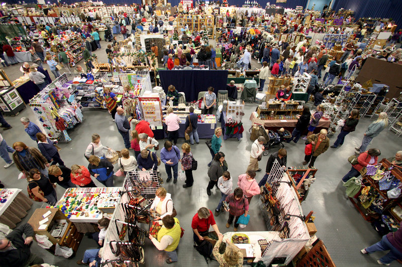 Shoppers make the rounds of booths at the Augusta Arts and Crafts Show. The show is hosted by the United Maine Craftsmen. The show's director, Aletha Boyle, says that "everything has to be made by the crafter. And not simple assembly, something that's a creation."