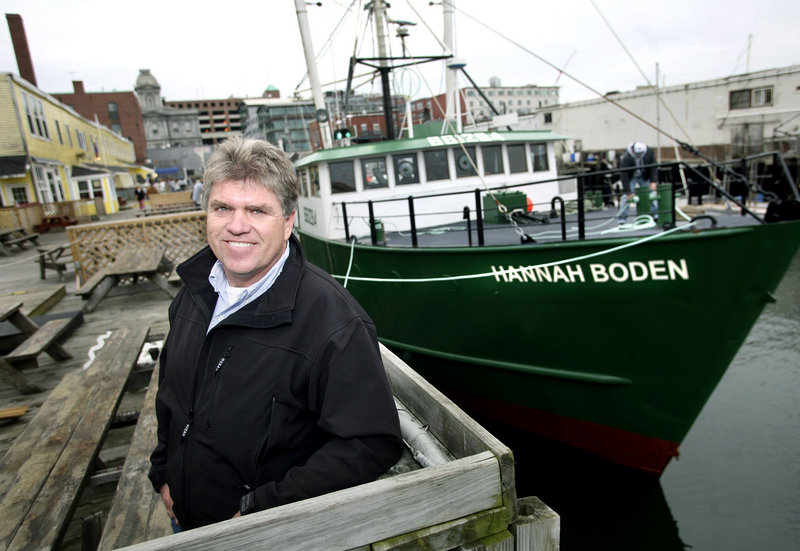 Jon Williams, a fisherman from Westport who has built a business around deep-sea red crab fishing, stands near his boat, the Hannah Boden, along the Portland waterfront.