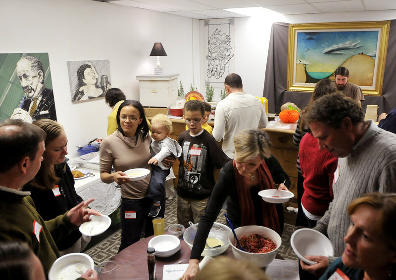 Guests enjoy sampling appetizers during the all vegan Gentle Thanksgiving Dinner held recently at the Urban Farm Fermentory in Portland. The annual potluck event is hosted by the Maine Vegan Meet Up group and this year attracted more than 40 guests.