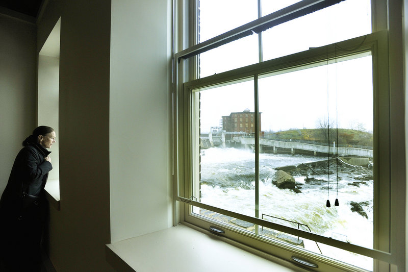 Millie Monks of Cape Elizabeth looks at a view of the Saco River from an apartment in The Mill at Saco Falls.