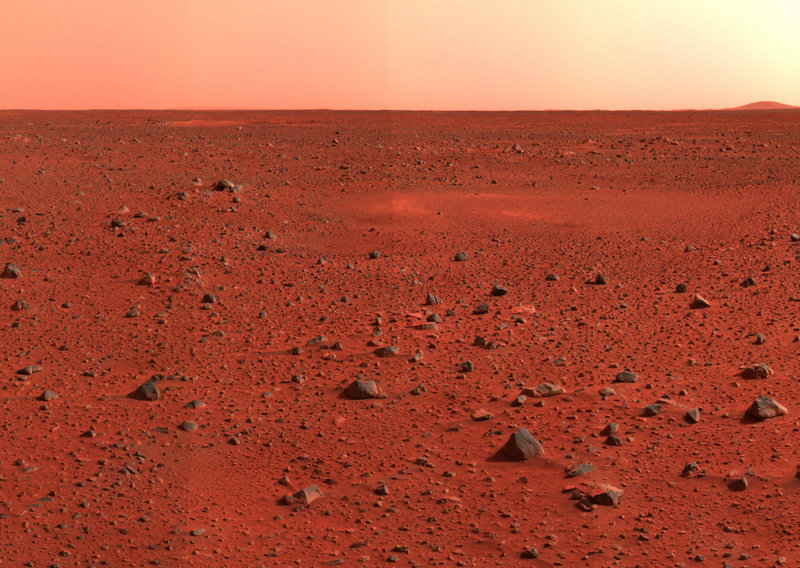 Mosaic image taken by the Mars Exploration Rover Spirit’s panoramic camera shows a view of Mars southwest of the rover’s landing site in the Gusev Crater. Two scientists propose sending volunteers to Mars and leaving them there. They say the mission would mark the beginning of long-term human colonization of Mars.