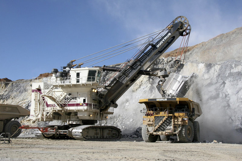 A Bucyrus International 495HR electric mining shovel loads a Cat 793C mining truck at a mine site. Caterpillar Inc., the world s largest construction and mining equipment maker, said Monday, Nov. 15, 2010, it has agreed to buy Bucyrus International Inc. for $7.6 billion in cash.