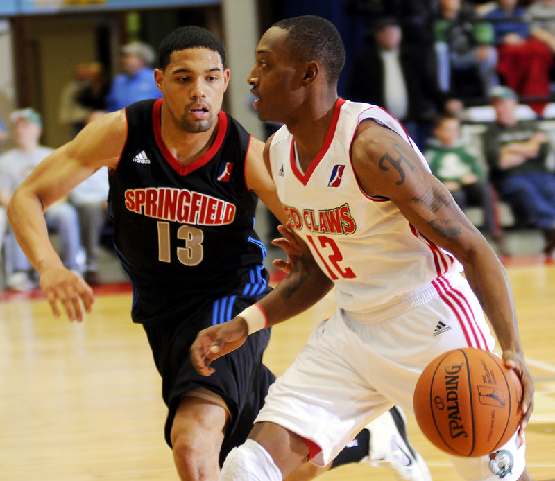 Maine's Kenney Hayes, right, dribbles past Springfield's Scottie Reynolds during the Red Claws' 102-88 win Monday night in an exhibition game. Paul Harris scored 17 points to lead the Red Claws in their only preseason game.
