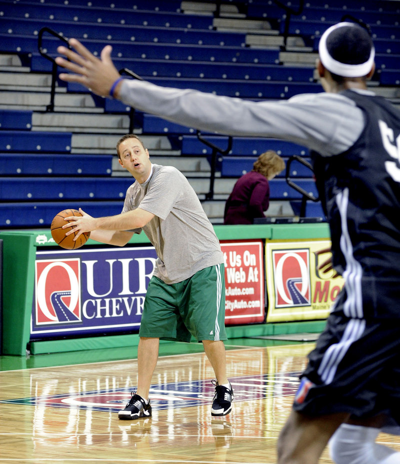 Red Claws Coach Austin Ainge works with players during a practice Tuesday. Ainge and the team's management must trim the roster from 13 to 10 players.