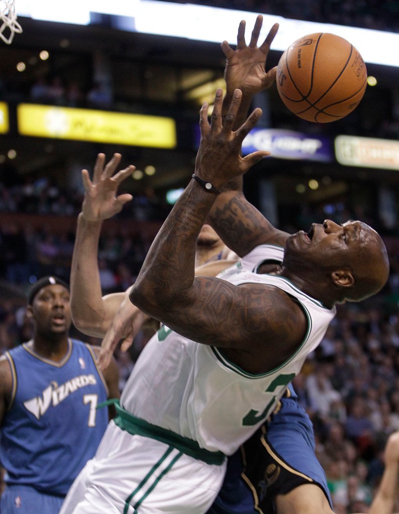 Shaquille O’Neal of the Celtics loses control of an offensive rebound in front of Washington’s Andray Blatche Wednesday night. O’Neal had 13 points in Boston’s 114-83 win.