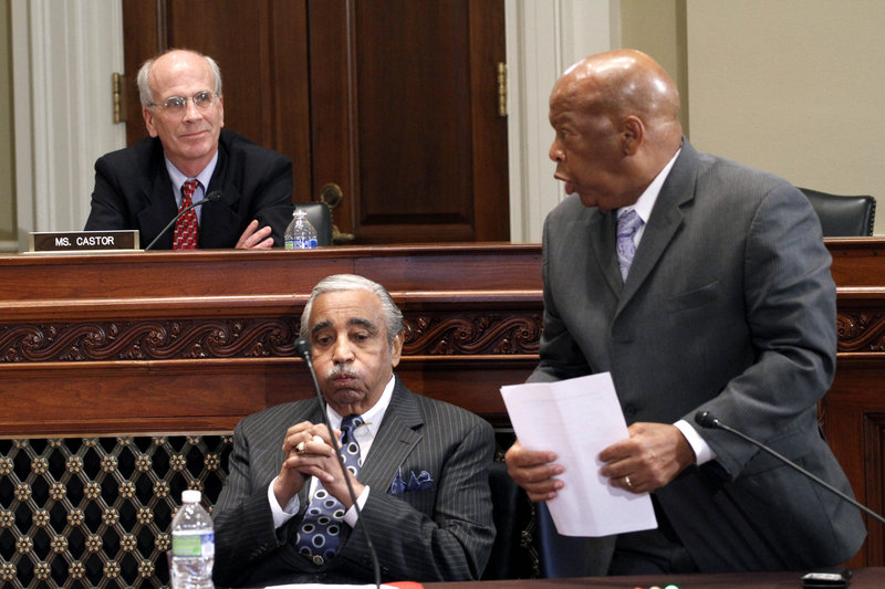 Democratic U.S. Rep. Peter Welch of Vermont listens as Rep. John Lewis, D-Ga., right, speaks on behalf of Rep. Charles Rangel, D-N.Y., center, Thursday during the House Ethics Committee hearing. Rangel avoided paying taxes on rental income for 17 years, among other transgressions.