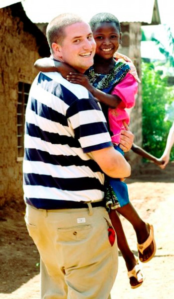 Seth Diemond poses with Elizabeth, a young girl he befriended in 2008 while volunteering in Tanzania. Thanks to his financial support, Elizabeth is now enrolled in a private boarding school.