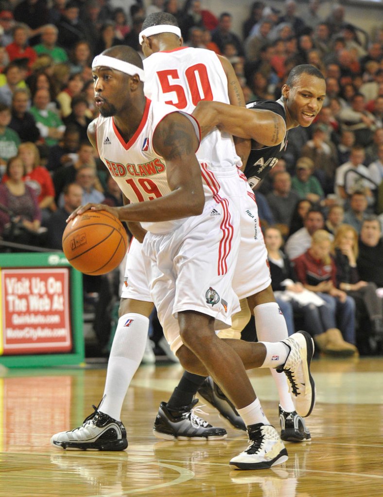 Mario West of the Maine Red Claws uses a screen set by Magnum Rolle to lose his defender and drive to the basket.