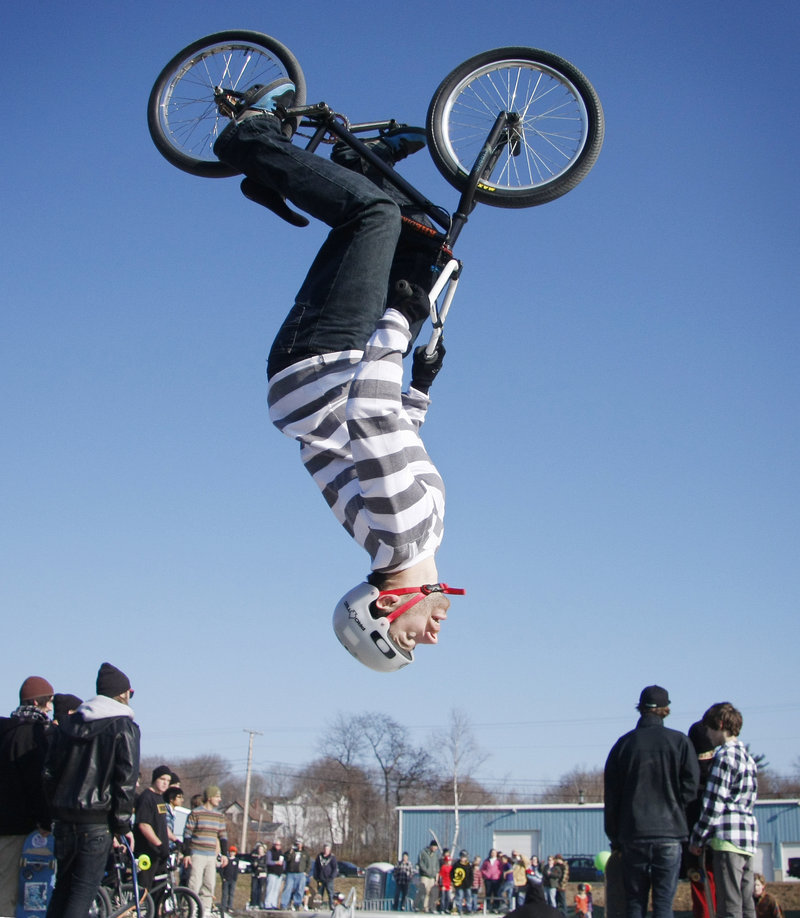 Andy MacKellar of Topsham does a back flip at the new skatepark in Portland on Saturday. City funding and private donations underwrote the $250,000 facility.