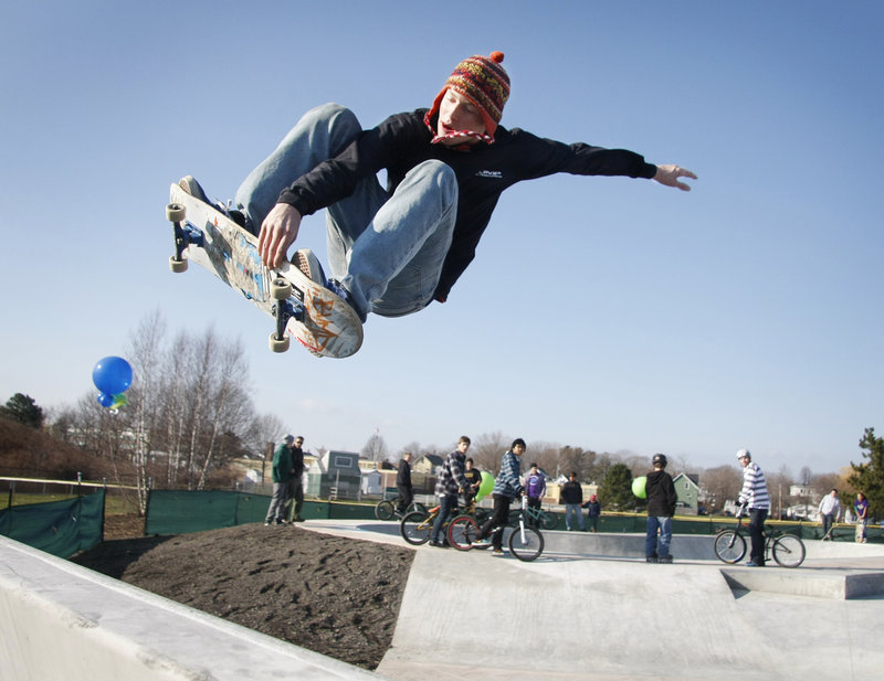 Chris Peterson of Winthrop flies at the opening of the new skatepark at Dougherty Field on St. James Street in Portland on Saturday.