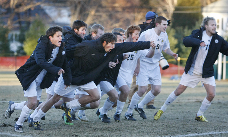 Bowdoin players react after the winning penalty kick by freshman Evan Gerschkovich ended the match.