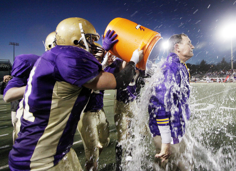 The game was won. The Class A state championship was won. And Cheverus Coach John Wolfgram got the shower from his players Saturday as the Stags completed their 46-8 dismantling of Bangor at Fitzpatrick Stadium. It was Cheverus' first state title in 25 years.