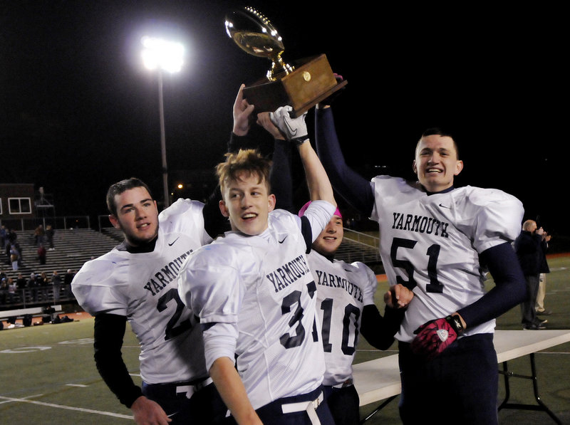 Yarmouth raised a football Gold Ball for the first time. Doing the honors were, left to right, captains Nick Proscia, Asa Arden, Nate Pingitore and Jack Watterson.