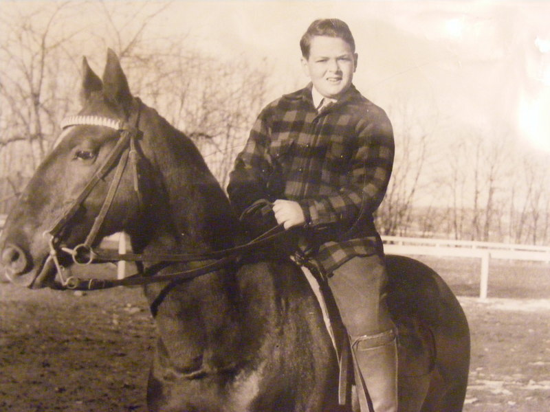 Robert Levine is shown in his youth astride a horse.