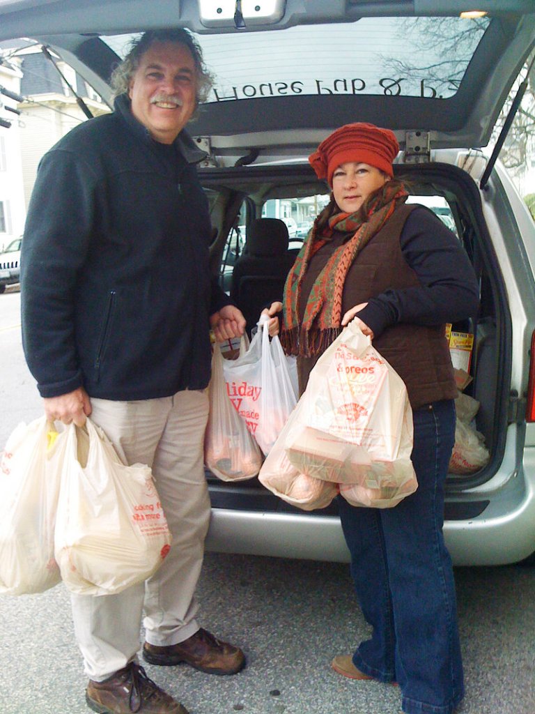 Jack and Vassie Fowler unload turkeys from their minivan Monday morning at the Stone Soup Food Pantry in Biddeford. "They have been our biggest help," says Kathy Duke, director of the pantry.