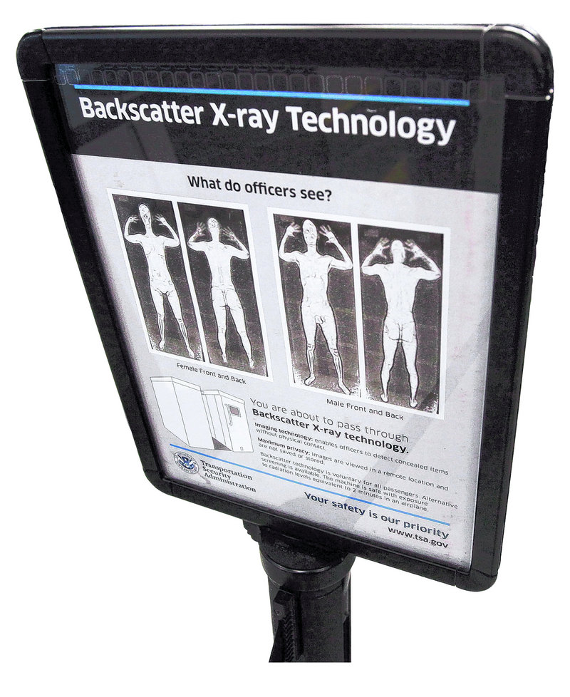 At Boston's Logan International Airport, an advisory describes X-ray body scanners, which are not yet in use in Portland.